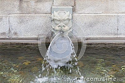 Stone dragon fountain head water spout Stock Photo