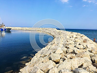 Stone embankment in the yacht lagoon Stock Photo