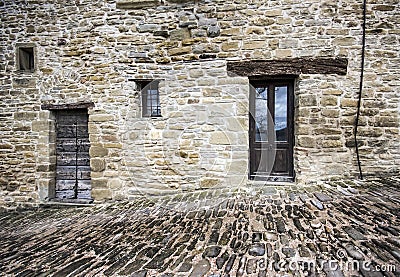 Stone faÃ§ade and cobble street Stock Photo