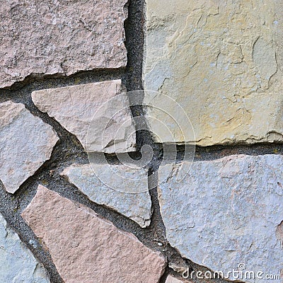 Stone fence background, stonewall macro closeup, decorative limestone dolomite calcium carbonate hard sedimentary slate slab rock Stock Photo
