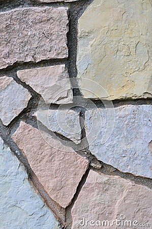 Stone fence background, vertical stonewall closeup, decorative limestone dolomite calcium carbonate hard sedimentary slate slab Stock Photo