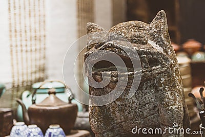 Stone figure in old antique shop in China Stock Photo