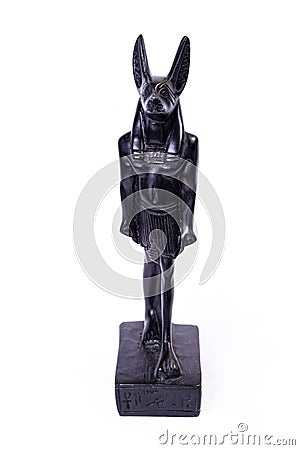 stone figurine of egyptian god Anubis with jackal head isolated on white background Stock Photo