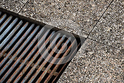 Stone floor with shaft detail with iron and rusted grates outside Stock Photo