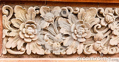 Stone flower pattern in temple of Ubud. Stock Photo