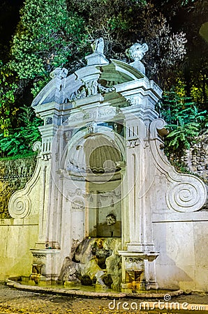 Stone fountain Prigione autumn night in Rome, Italy Stock Photo