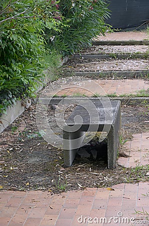 stone garden path bench abandoned lost place Stock Photo