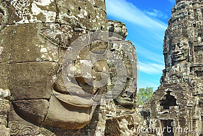 Stone head on towers of Bayon temple Stock Photo