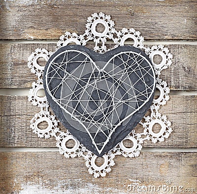 Stone heart on wooden background Stock Photo