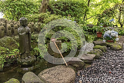 Stone Jizo Bodhisattva Statues and Tsukubai Water Fountain in Hasedera Temple, Kamakura, Japan Stock Photo