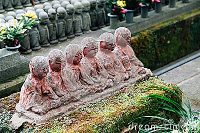 Stone Jizo buddha statue at Hasedera temple in Kamakura, Japan Stock Photo