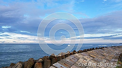 Stone Levee Build Against Erosion of the Beaches Stock Photo