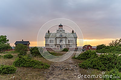 Stone lighthouse building in summer afternoon sun on Stora Karlso. Gotland, Sweden Stock Photo