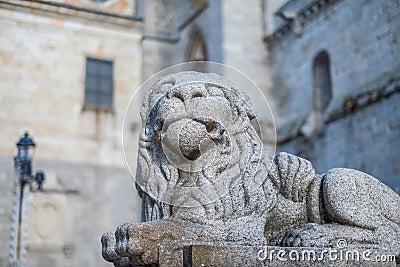 Stone lion guarding the Gothic cathedral of Avila Stock Photo