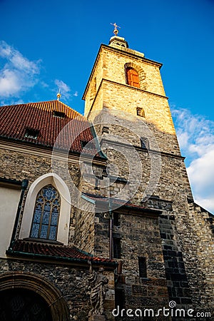 Stone medieval gothic church St. Henry and St. Kunhuty at sunny day, high tower, stone statues, stained glass windows, arched Editorial Stock Photo