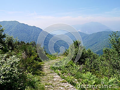Stone mule trail at Cima Sasso in Val Grande, national park in Piedmont, Italy with views of Lago Maggiore. Stock Photo