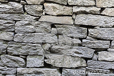 Stone natural rock texture background. Modern grunge wall castle made old granite of blocks. Wall rough old piece rock of mountain Stock Photo