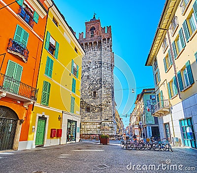 The stone Pallata Tower from Vicolo due Torri street, Brescia, Italy Stock Photo
