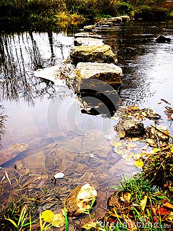 Stone path across the river Stock Photo