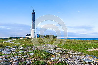 Stone path leading to the SÃµrve Lighthouse in Estonia Stock Photo