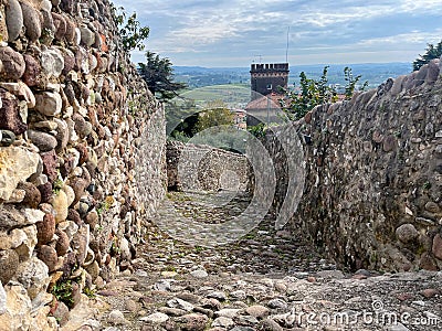 Stone path with stone walls to the castle in Cavaion Veronese, Italy Stock Photo