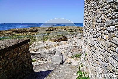 Stone pathway stairs to access water sea in low tide in talmont vendee french city Stock Photo