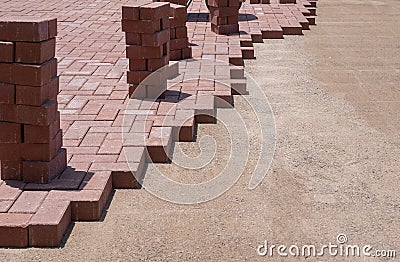 Stone Pavers bricks being layed on ground for landscaping project. Stock Photo