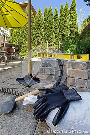 Stone Pavers and Tools for Backyard Hardscape Stock Photo