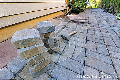 Stone Pavers and Tools for Side Yard Hardscape Stock Photo