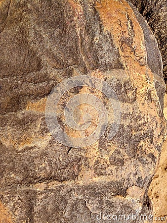 Stone with a picture on the beach Stock Photo