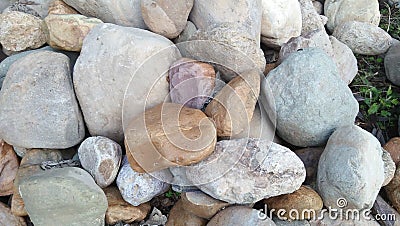 Stone pile brown, pink, and grey stone Stock Photo