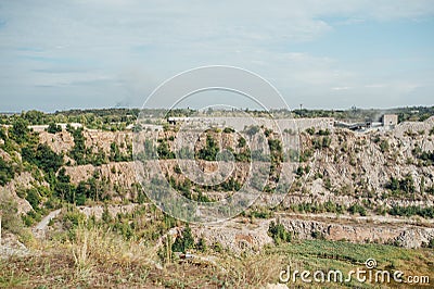 Stone quarry with excavate - Open pit mine Stock Photo