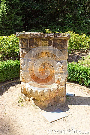 Stone reservoir with a spout for mineral water Stock Photo