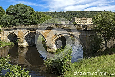 Stone road bridge over the River Derwent at Chatsworth house estate, Derbyshire Editorial Stock Photo