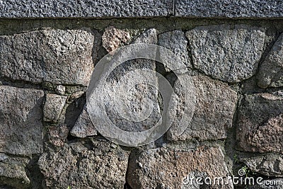A stone rock wall with a granite pillar. Vector stone texture background Stock Photo