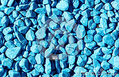 Stone rubble painted with blue paint. Background Stock Photo