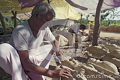 Stone sculptor carving idols of Hindu Gods Editorial Stock Photo