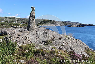 Stone sculpture in a coastal landscape in Norway, Europe. Stock Photo