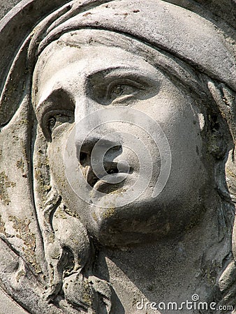 Stone sculpture of a grieving woman Stock Photo