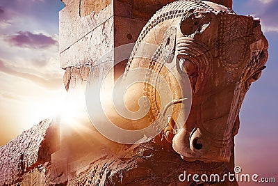 Stone sculpture of a horse in Persepolis against a sunrise. Iran. Persia. Shiraz. Rays of lights. Stock Photo