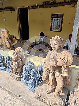 Stone sculpture and traditional artisans working in their workshop for creating Hindu and Buddhist idols. Editorial Stock Photo