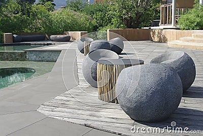Stone seating next to swimming pool Stock Photo