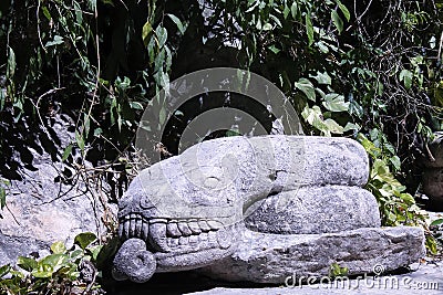 Stone snake resting in the road Editorial Stock Photo