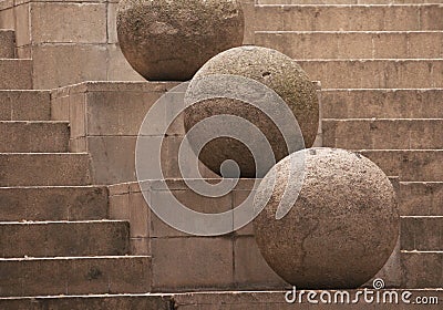 Stone sphere on the stairs background Stock Photo