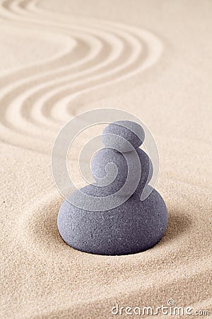 Stone stack, Japanese zen sand garden with pile of rocks Stock Photo