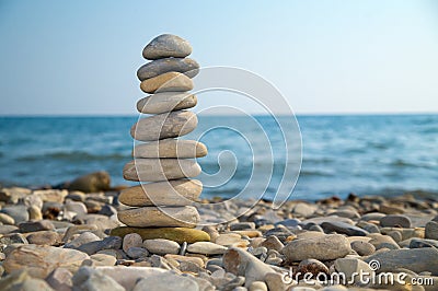 Stone stack on a pebble beach Stock Photo