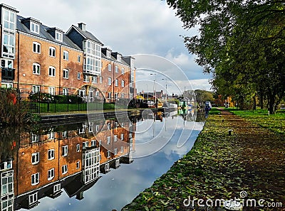 `Joules Court` retirement house and its reflection in Trent and Mersey Canal in town called Stone Editorial Stock Photo