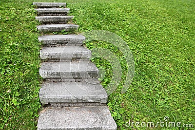 Stone staircase among green grass Stock Photo