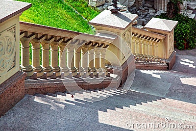 Stone staircase with handrails beige balustrades in retro baroque style. Stock Photo