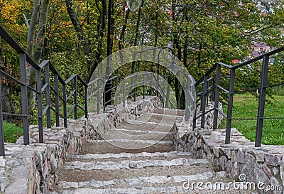 Stone stairs with a metal handrail, Checiny Castle Stock Photo
